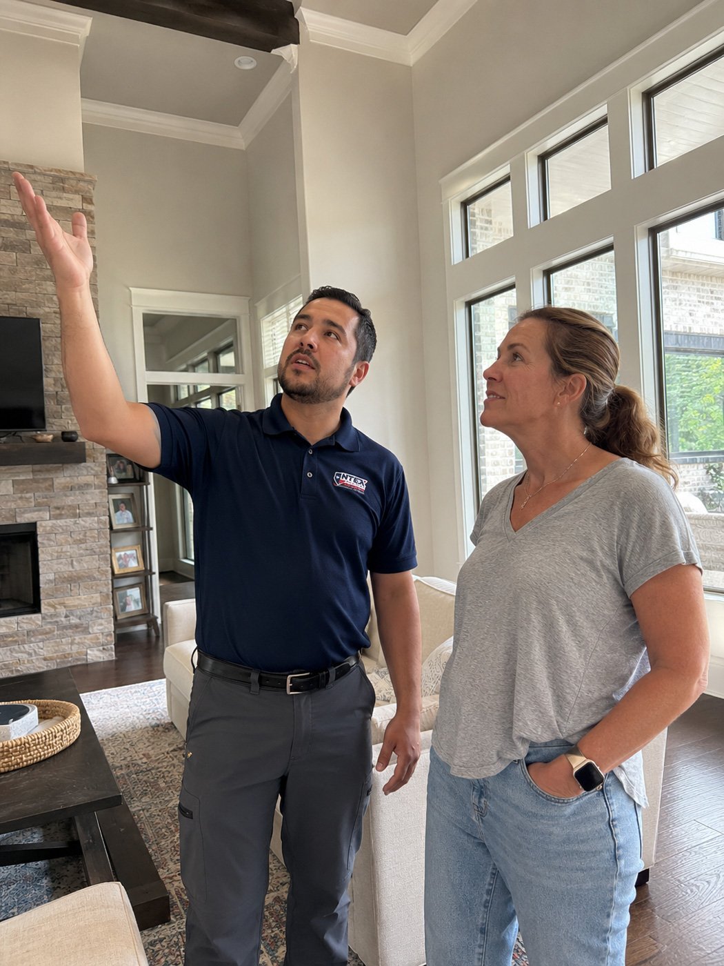 Home Security Systems 6 Licensed NTEX Security technician reviewing a home security system with a North Texas homeowner.